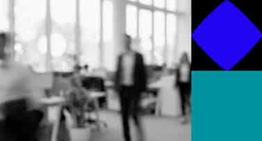 Blurred People Walking Through an Office Setting with Blue and Teal Shapes