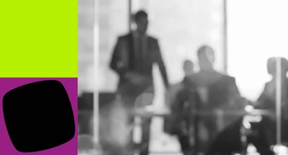Blurred People in a Meeting Room Through a Glass Window with Green and Purple Shapes