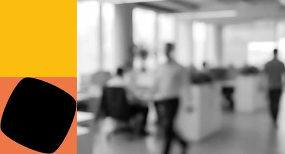 Blurred People Walking Through an Office Setting with Yellow and Orange Shapes