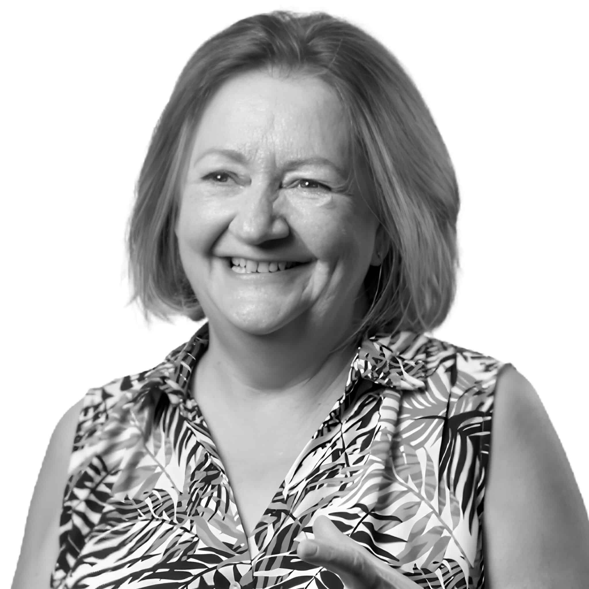 A black and white headshot photograph of Katie Taylor