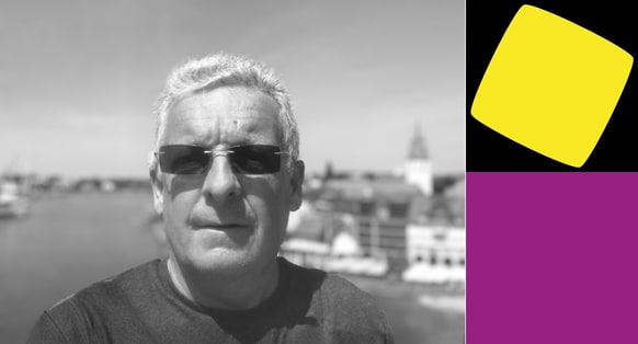 Dave White is shown in a selfie-style photograph. Hee's shown wearing a t-shirt and sunglasses and looking straight at the camera.