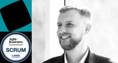 Black-and-white portrait of a smiling professional man beside the Scrum certification badge from Agile Business Consortium and APMG International.