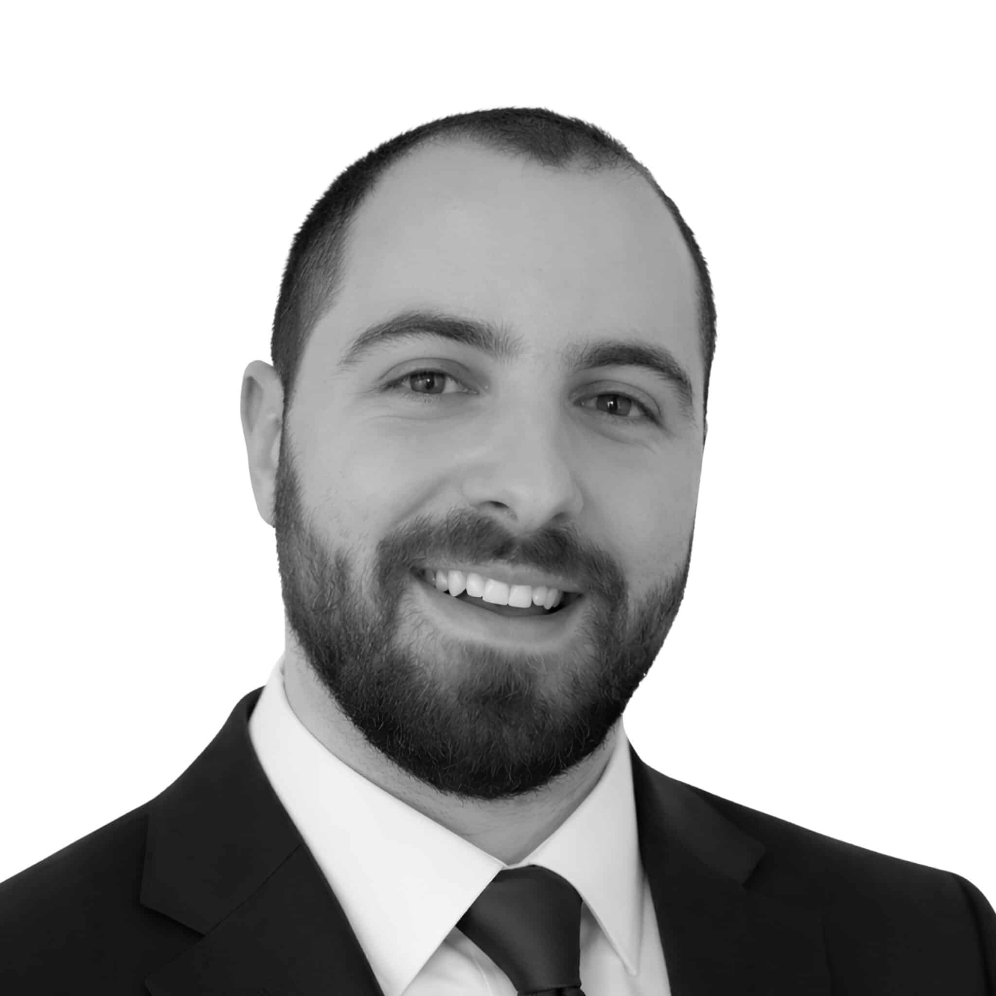 A black and white headshot photograph of Stanimir Vasev