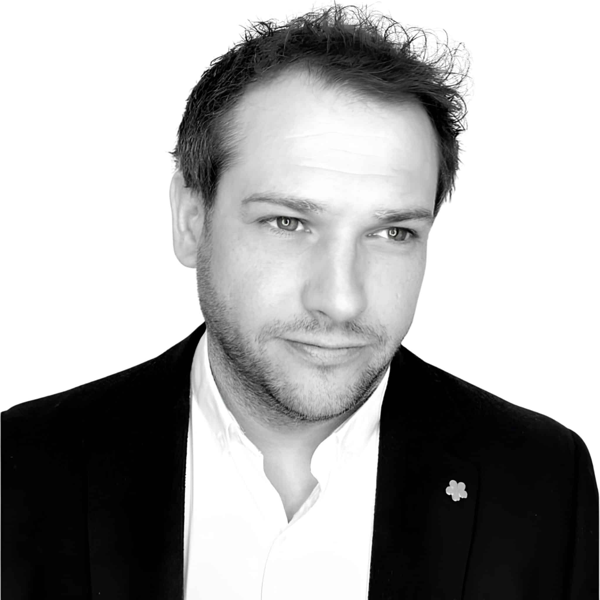A headshot photograph of Wayne Gosden