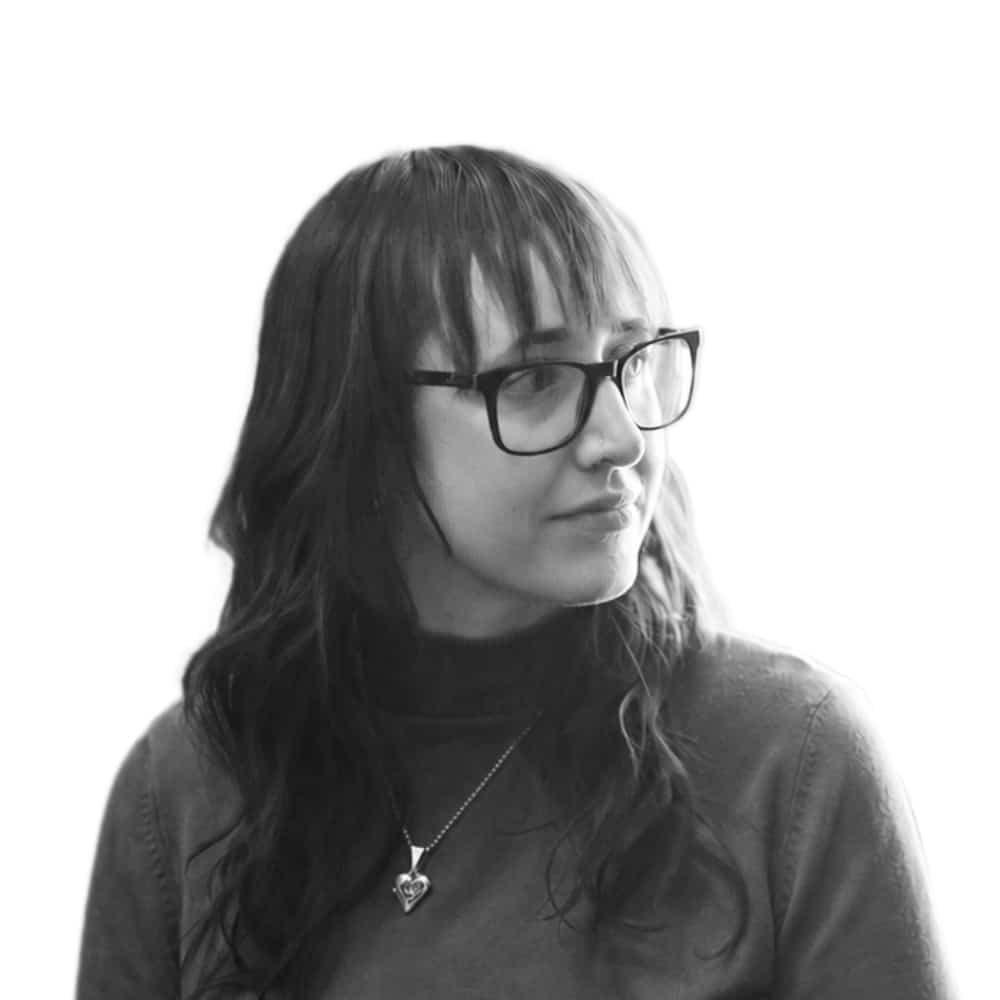 A black and white headshot photograph of Christina Reet