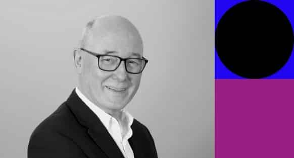 A black and white image of APMG CEO, Richard Pharro