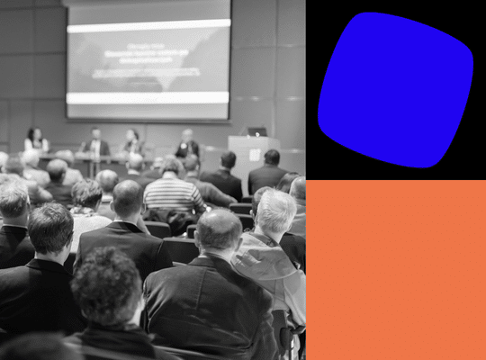 Image of an audience at a conference
